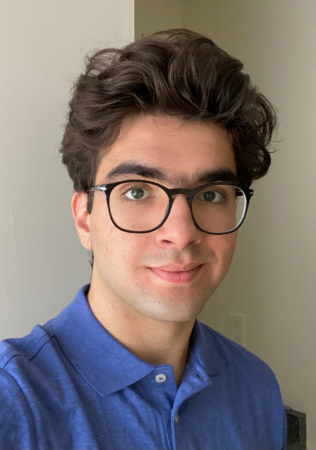Aydin Visanji selfie, wearing blue t-shirt with glasses